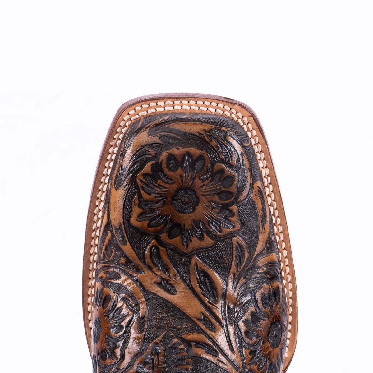 Close-up of the hand-tooled floral square toe on Tanner Mark men's TM205566 cowboy boots