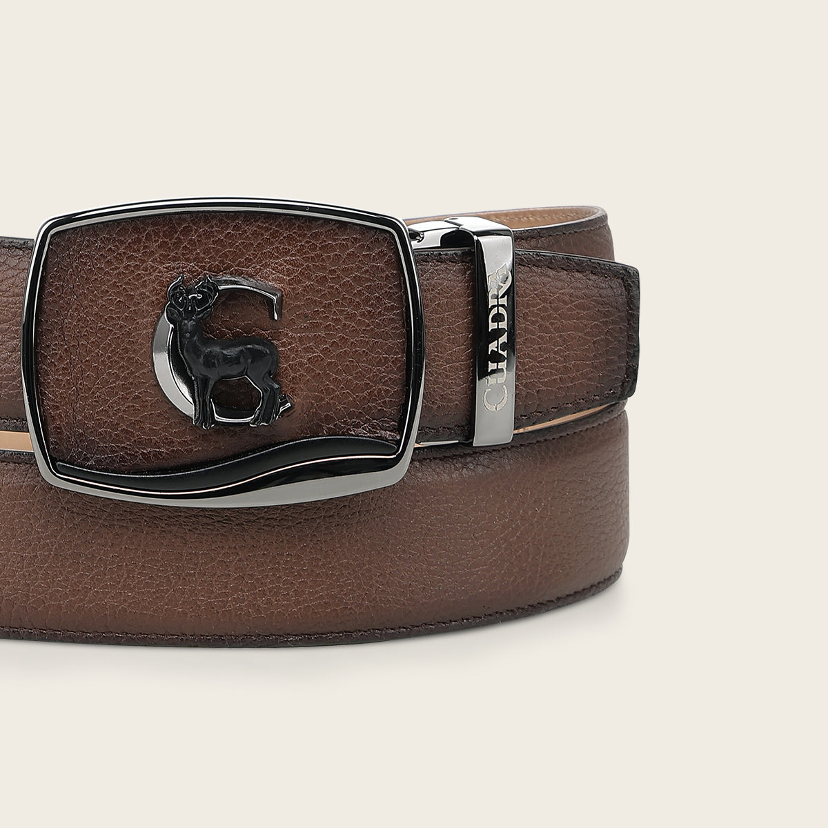 Close-up of the Cuadra BC580 retractable buckle with metal Cuadra monogram and inlaid deer figure